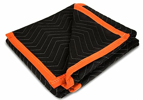 Black moving blanket with orange edges folded