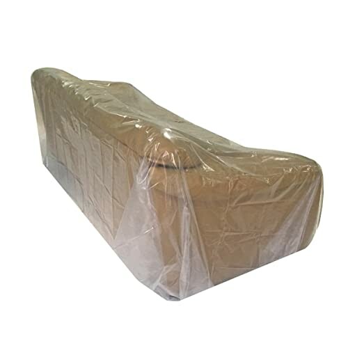 Sofa covered with transparent plastic sheet